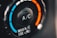 A close-up view of a car's air conditioning control knob, displaying temperature settings. The dial has blue and red colors indicating cooler and warmer temperatures, with the letters 'A/C' in the center. The text 'MAX A/C USE' appears below the dial.