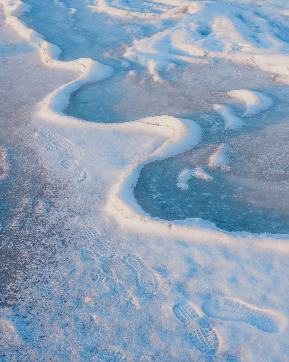 a view of some water and ice from a plane