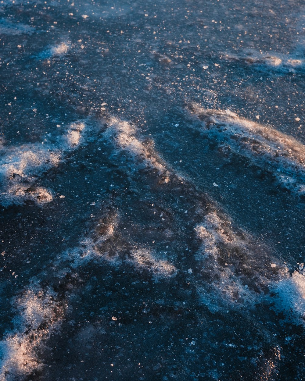 a close up of snow and ice on the ground