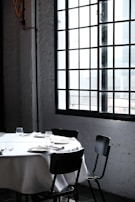 An elegant dining area set for a meal with soft lighting.