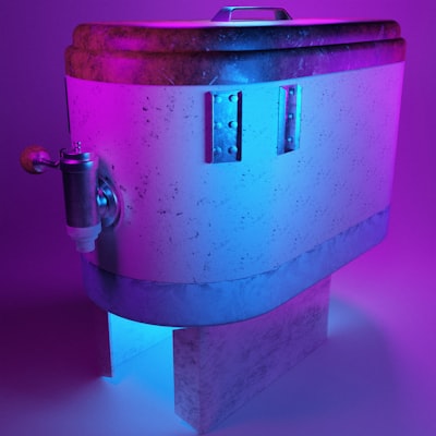 a large metal object with a purple light in the background