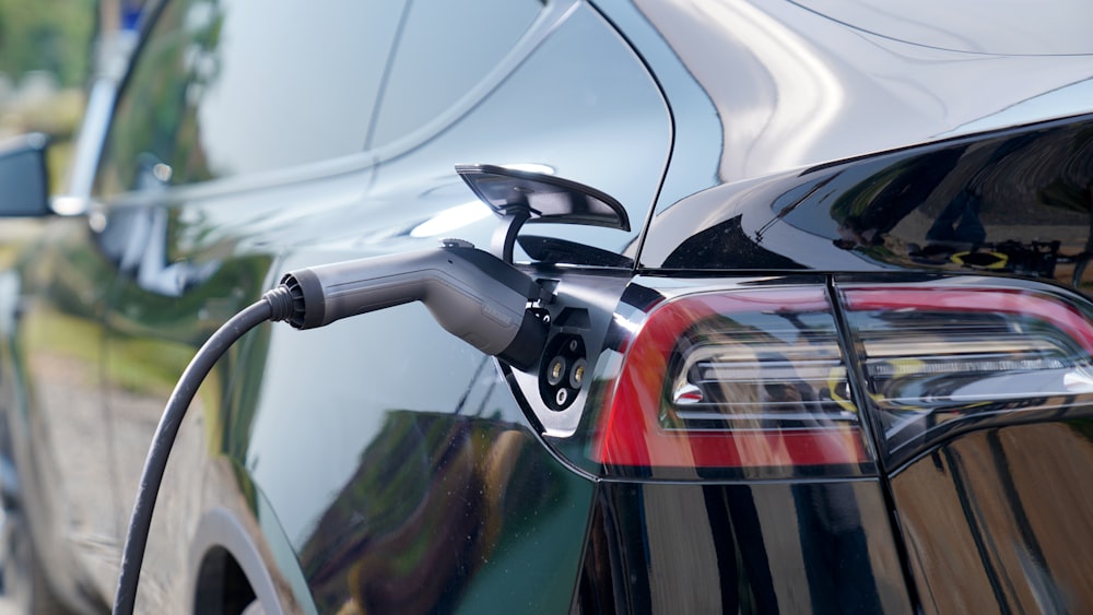 an electric car being charged by a charger