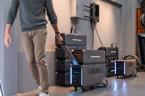 a man standing next to a stack of suitcases