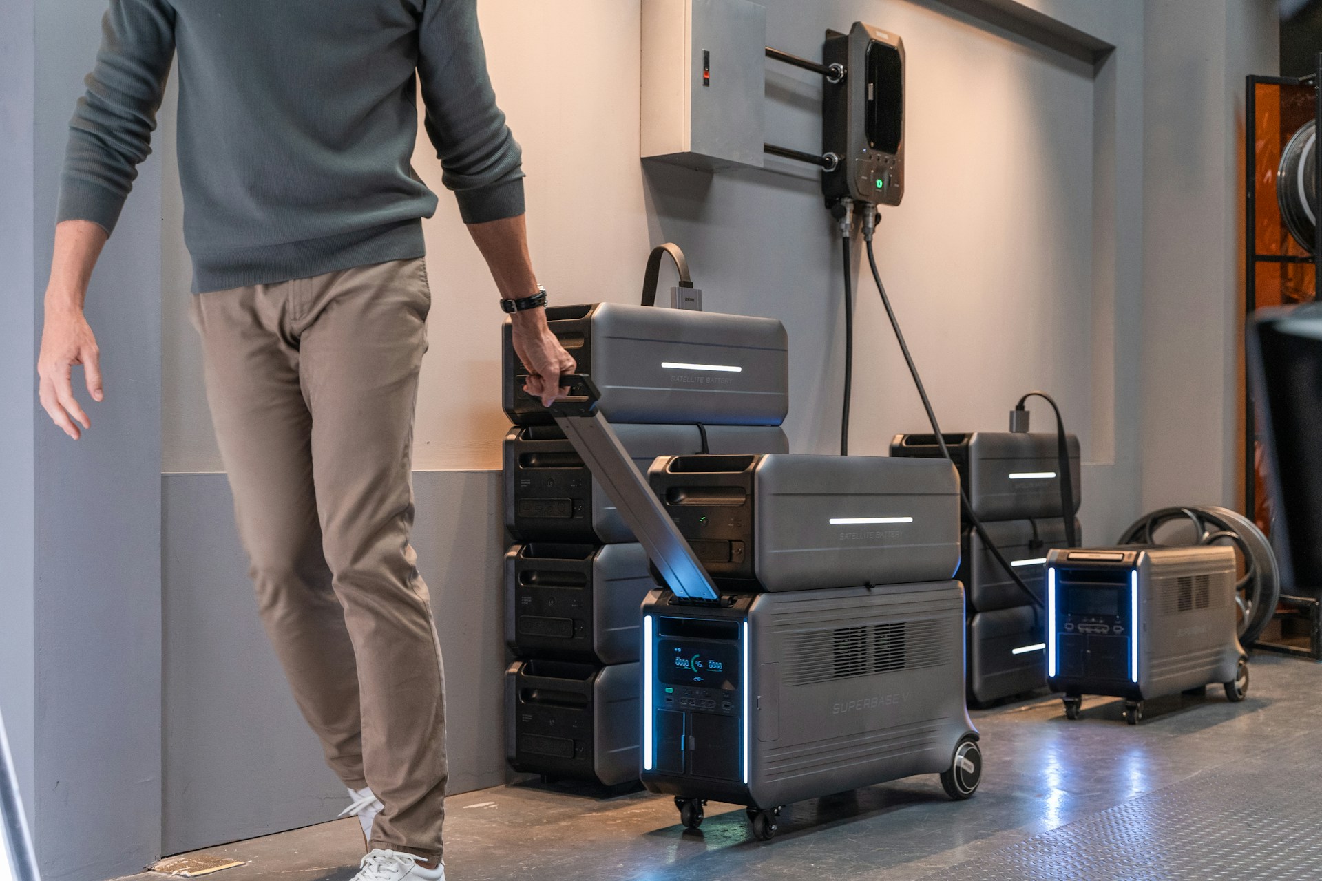 a man standing next to a stack of suitcases