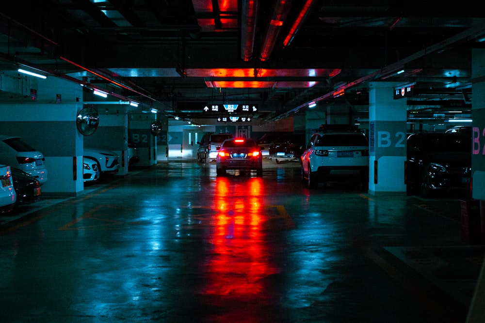 a parking garage filled with lots of parked cars