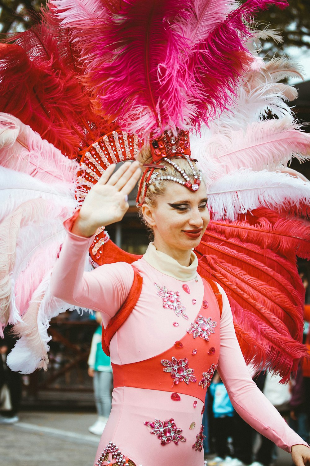 a woman in a pink and red costume