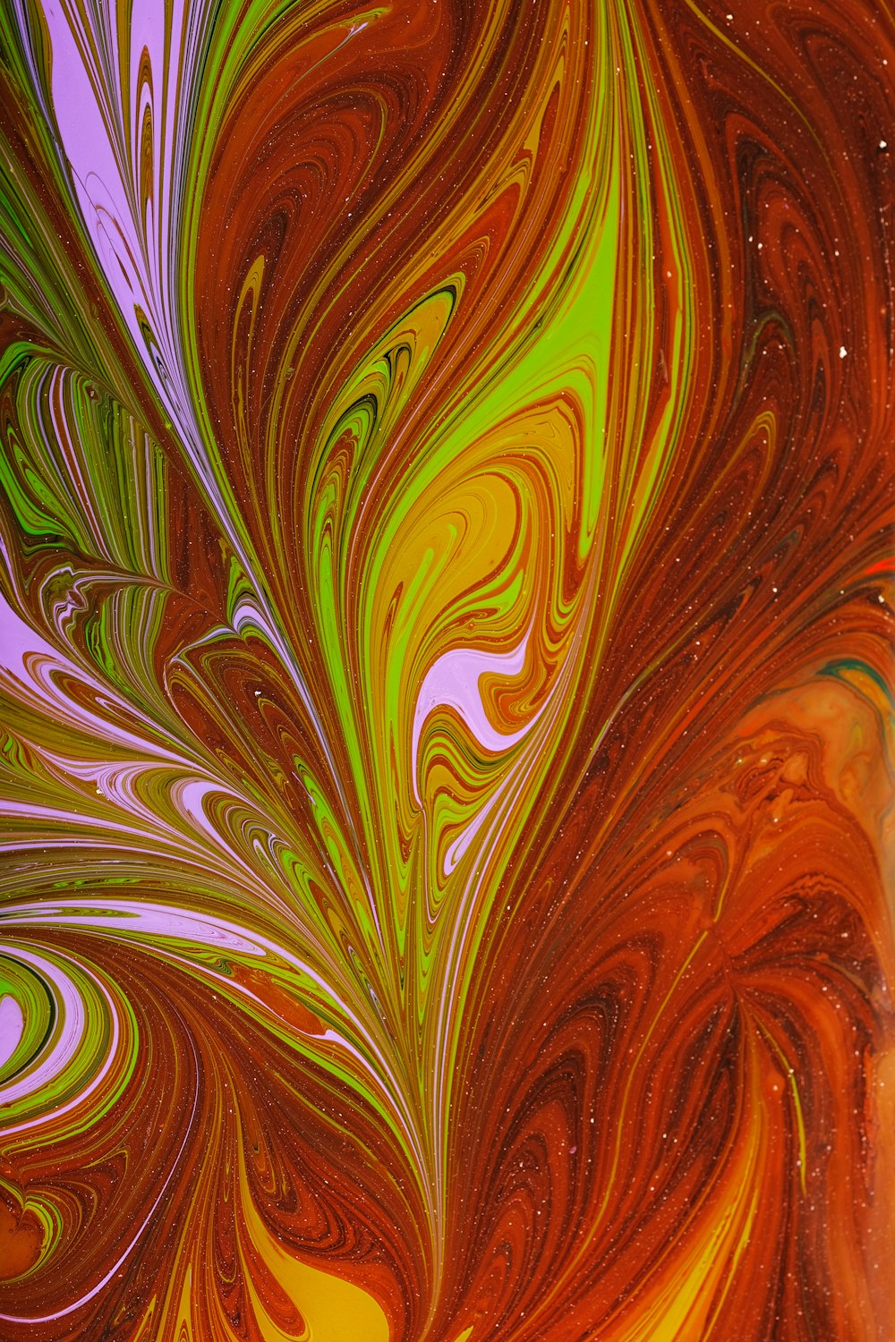 a close up of an abstract painting with orange and yellow colors