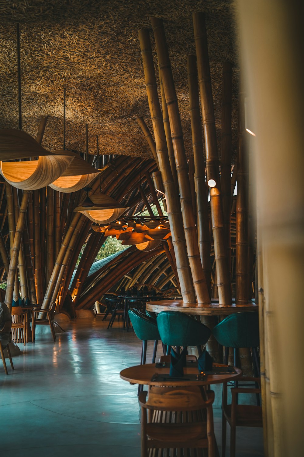 a restaurant with wooden tables and chairs