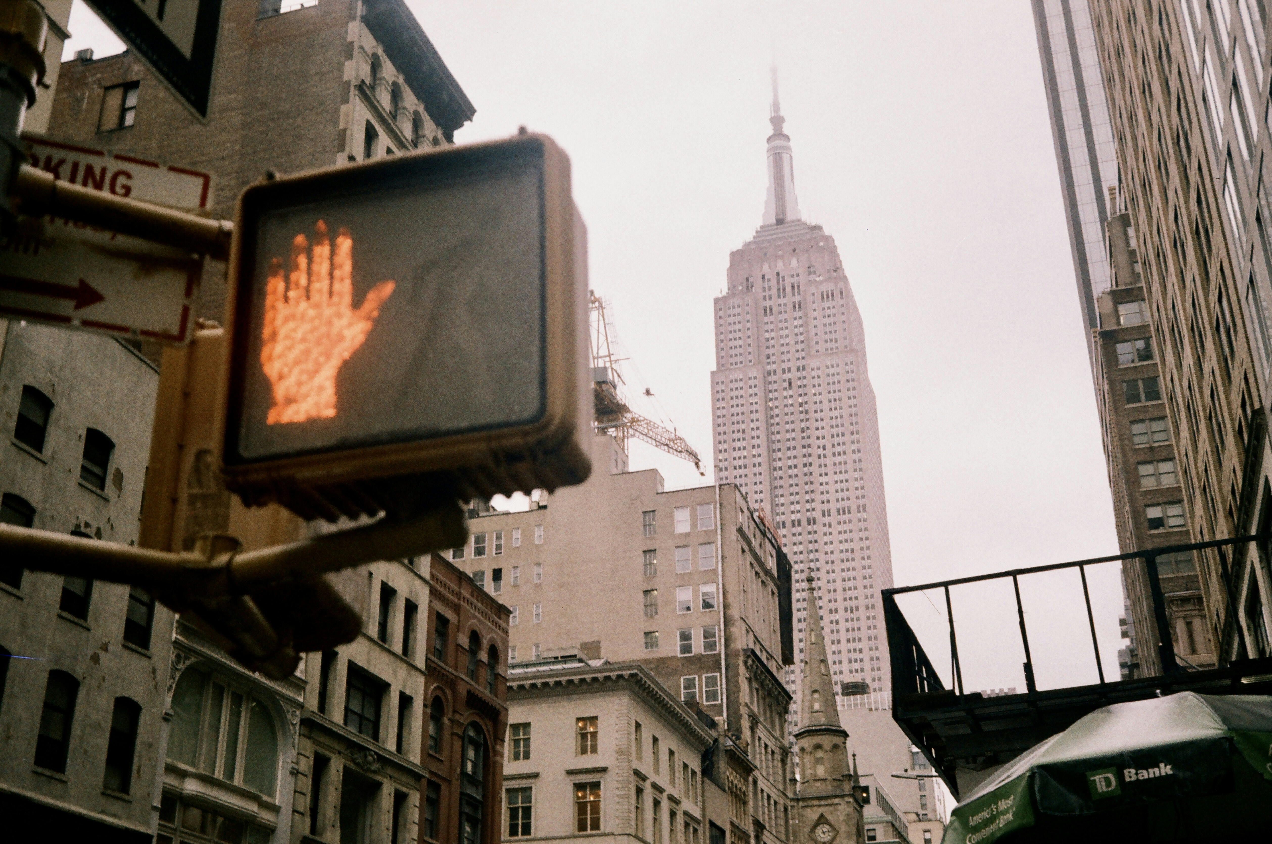 a traffic light with a building in the background