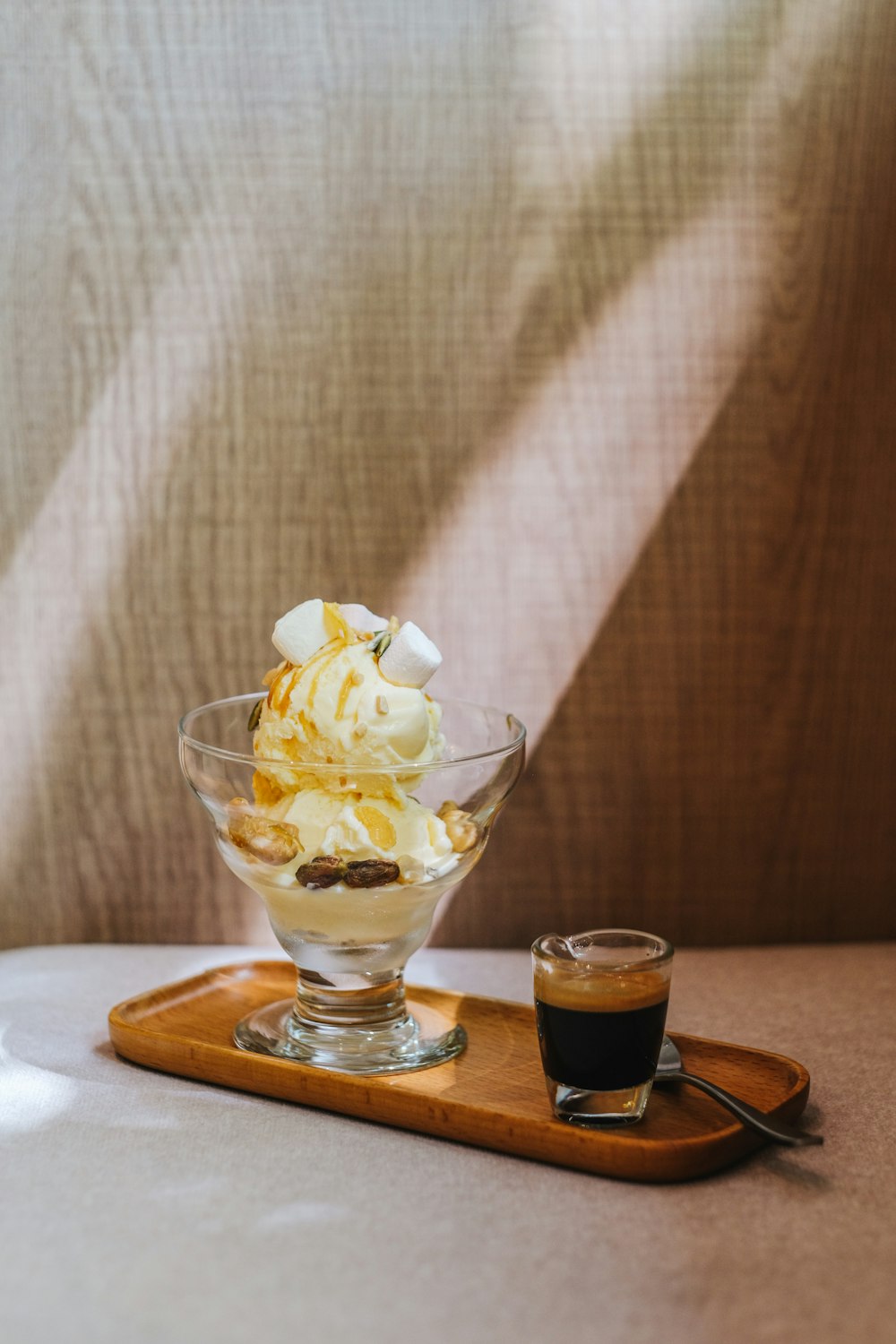 a bowl of ice cream and a cup of coffee