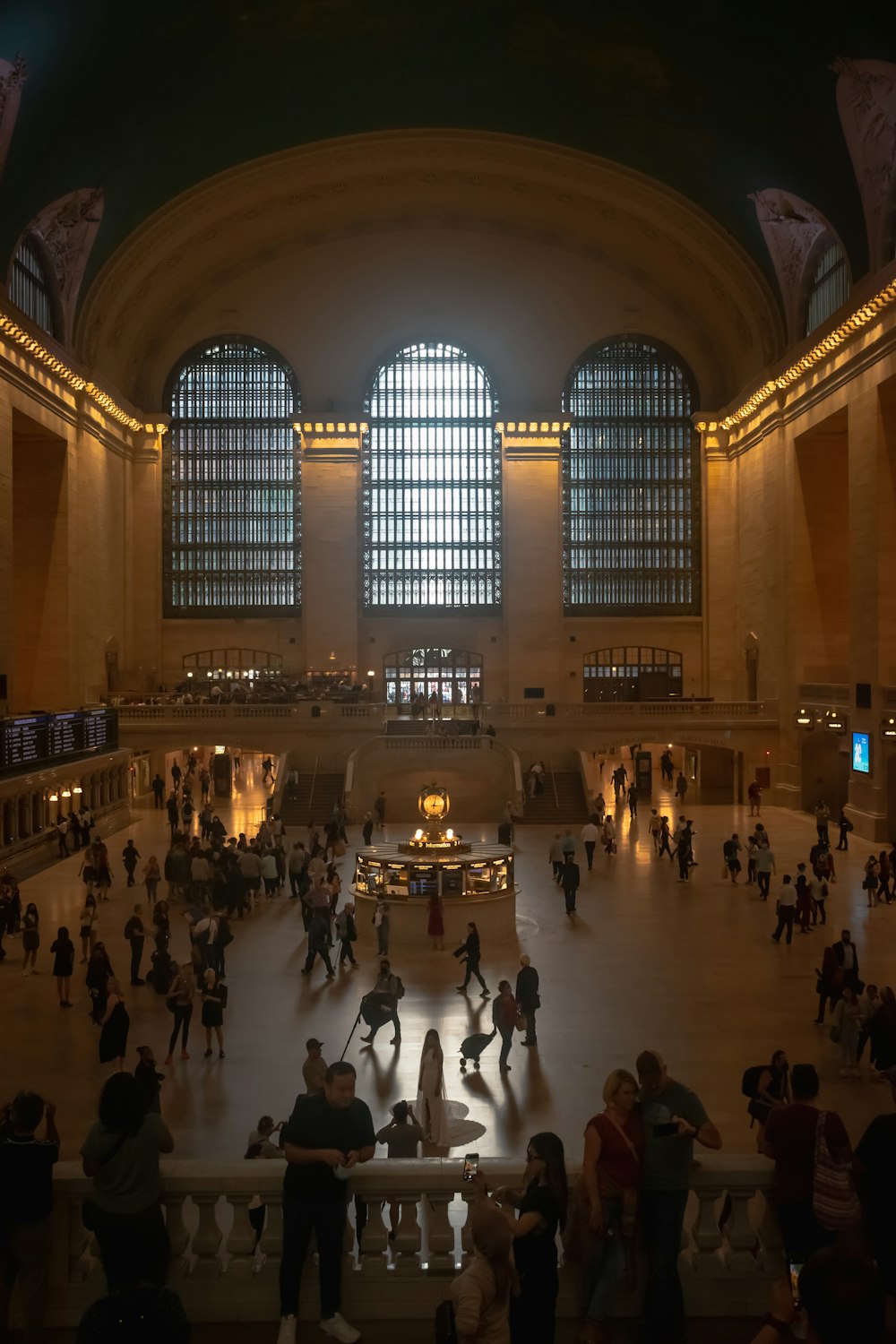 a group of people standing in a large building