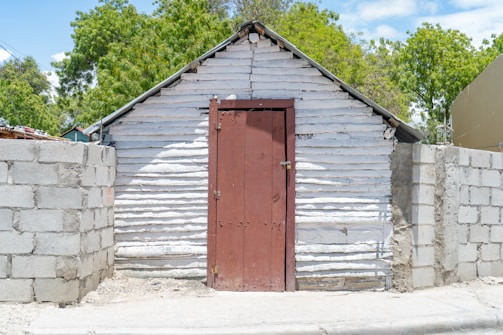 A freshly installed 20ft utility shed with a sleek metal exterior and secure locking doors.