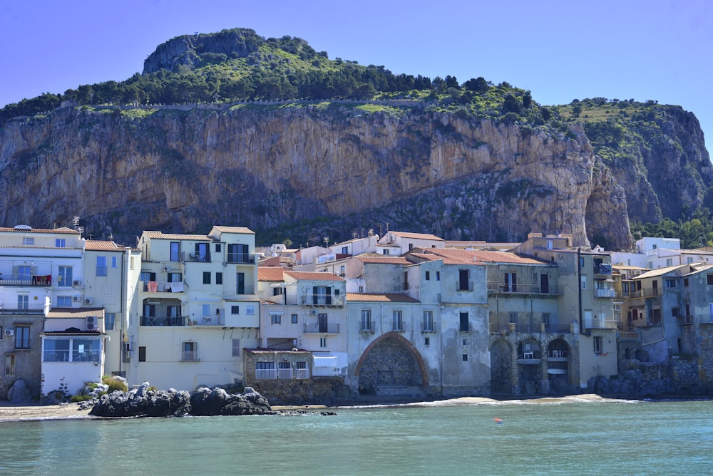 a group of buildings next to a body of water