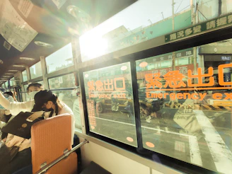 Public transport vehicle windows treated with anti-UV films for passenger comfort.