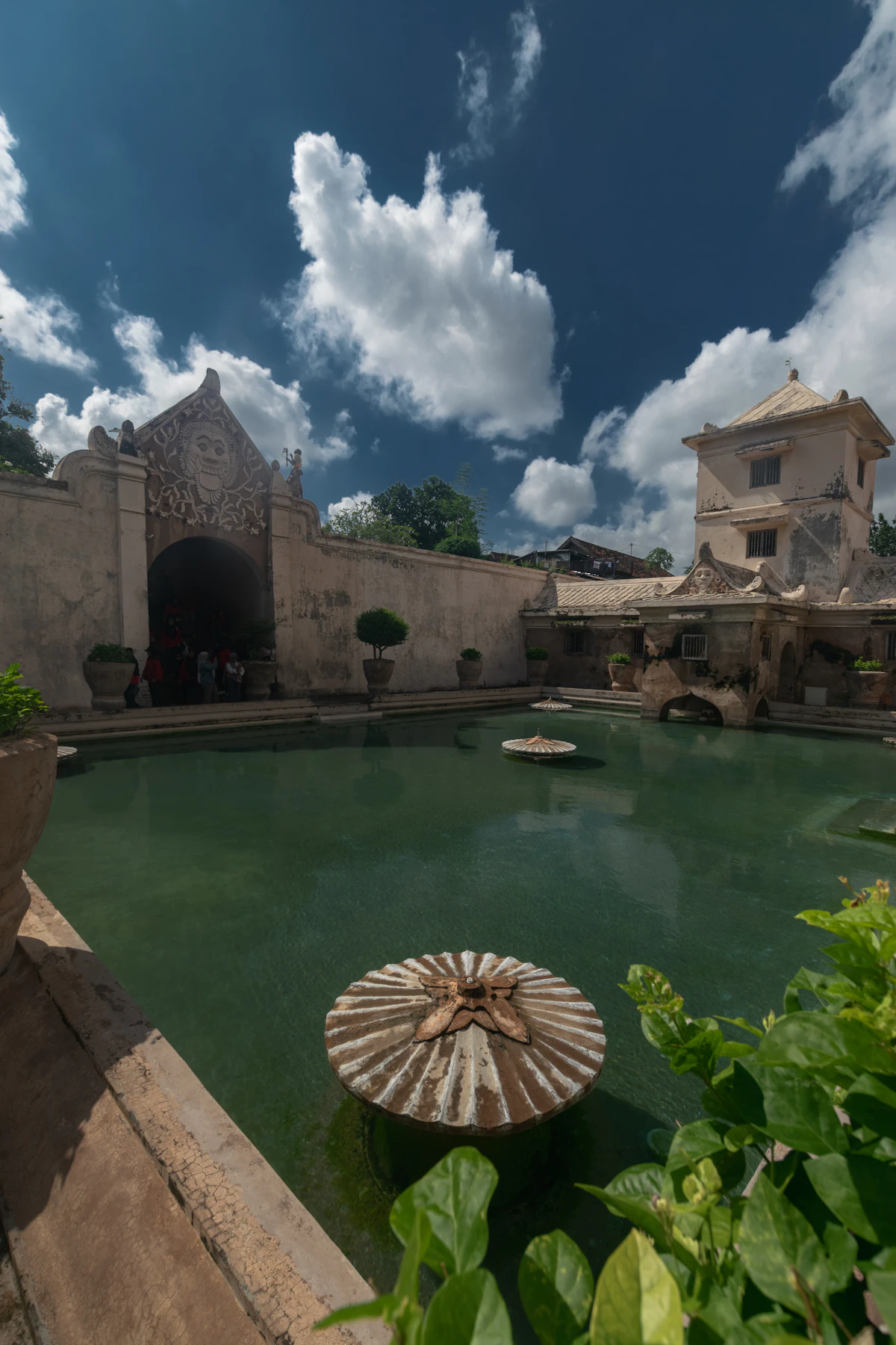 Sunlit royal bathing pools and ornate Javanese observation towers of Taman Sari Water Palace in Yogyakarta