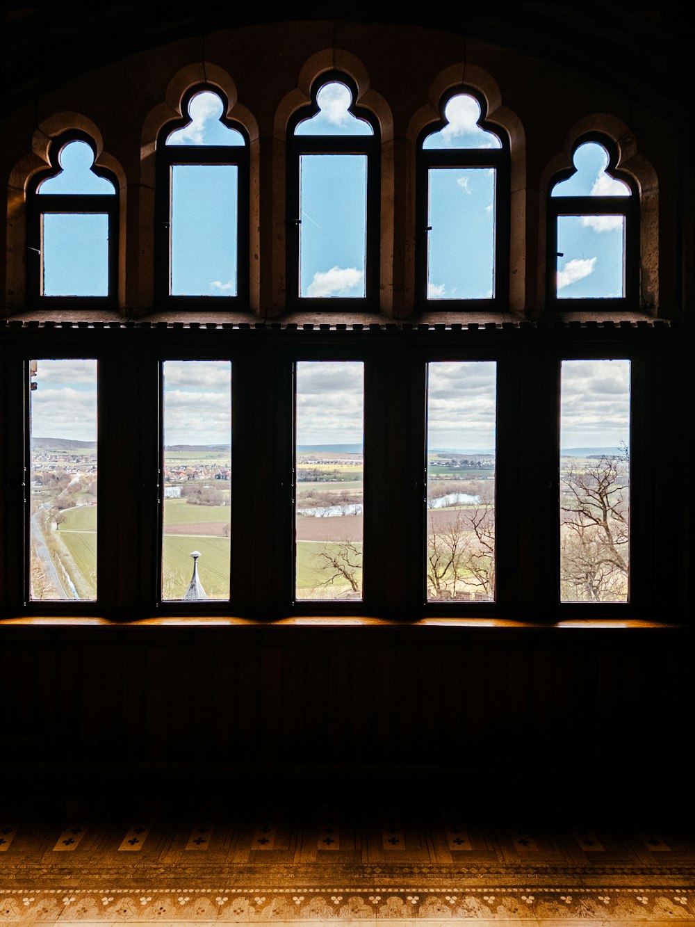 a window with a view of the countryside outside