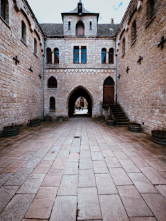 Wide shot of a courtyard with clean, restored paving stones after professional washing.
