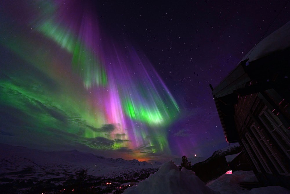the aurora lights shine brightly in the night sky