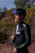 An athlete smiling after a cycling session, wearing by sport academy gear, with a backdrop of the Egyptian desert.