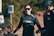 a woman wearing a black jacket and sunglasses