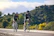 a couple of people riding bikes down a road