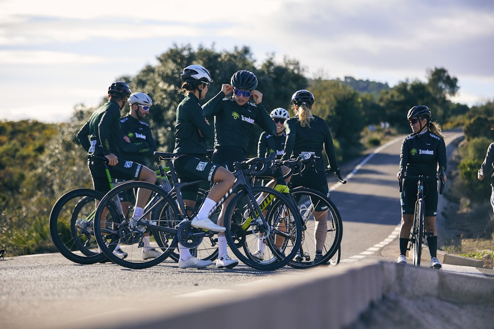 a group of people standing around with their bikes