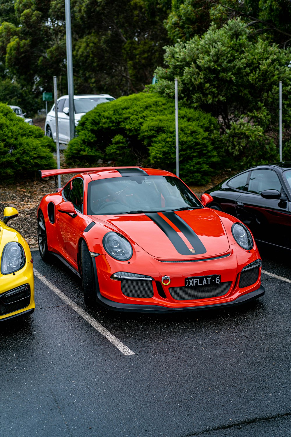 a couple of cars parked in a parking lot