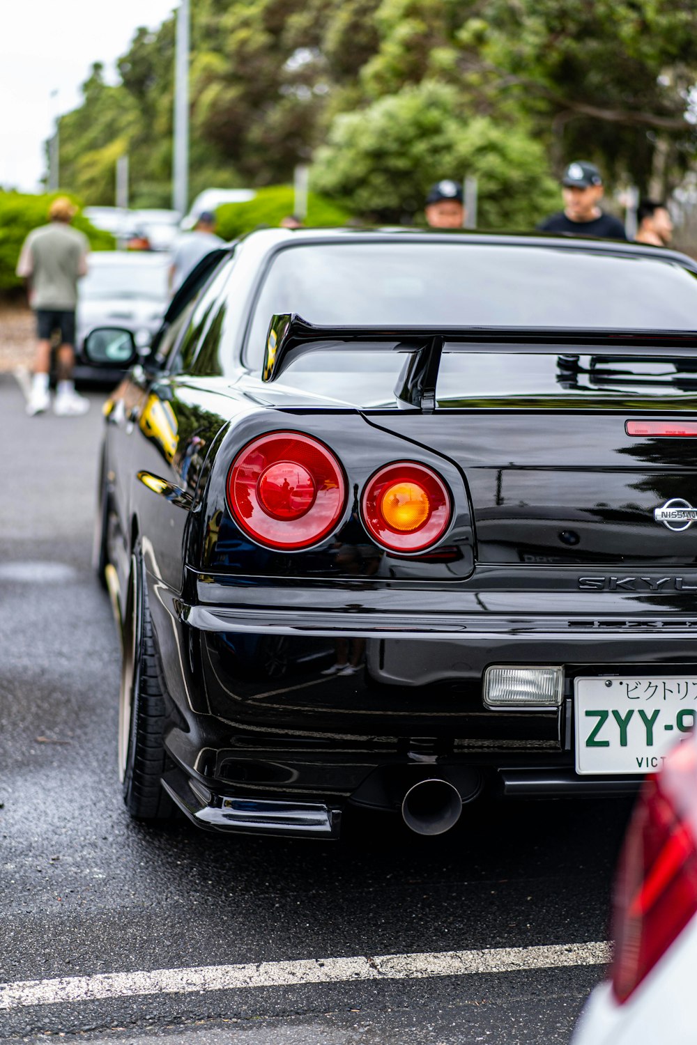 a black car parked on the side of the road