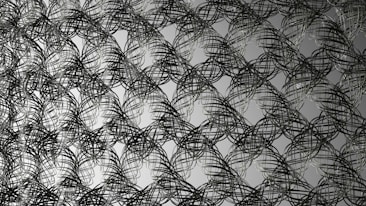 Intricate overlapping wire patterns forming abstract interconnected loops, creating a visually complex and dynamic design. The wires appear to weave in and out, suggesting depth and movement.