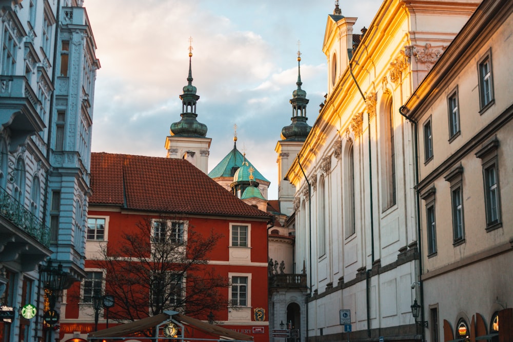 a city street lined with tall buildings and a clock tower