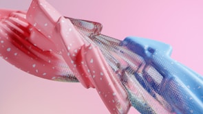 Playful abstract portrait in shades of pink and peach with rounded shapes.