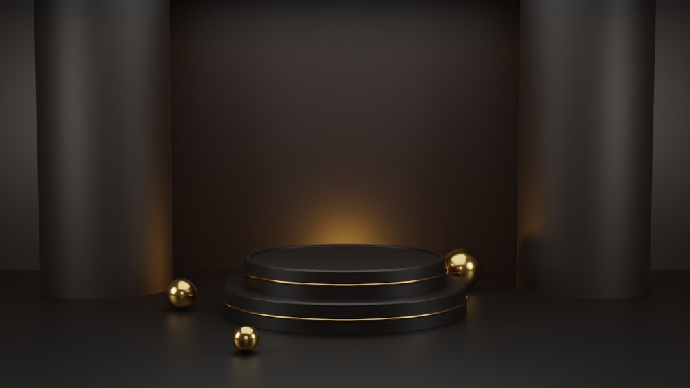 Un podio negro con bolas doradas sobre fondo negro