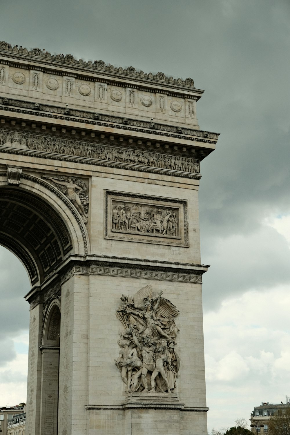 a very tall monument with a clock on it's side