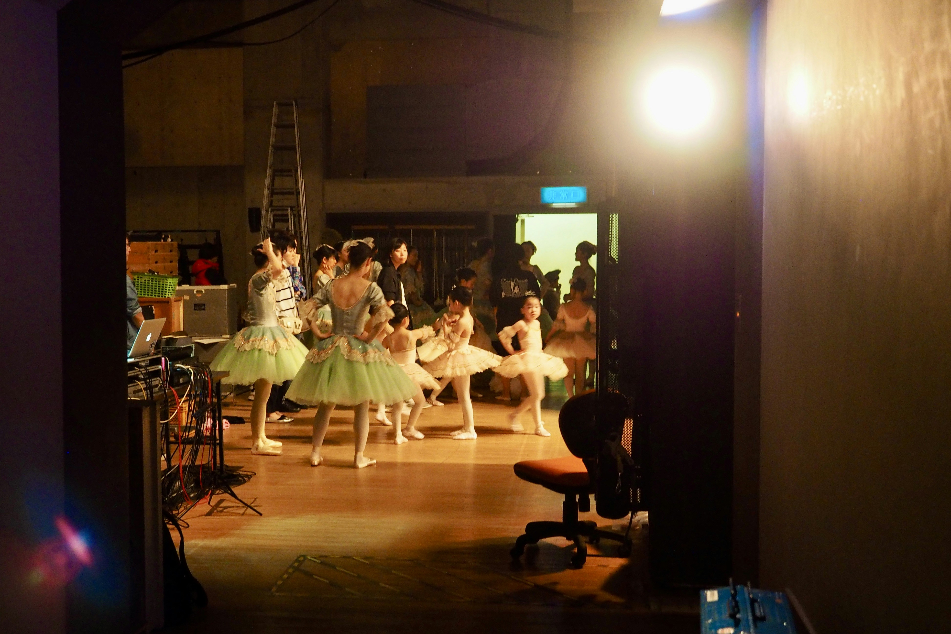 A group of young ballerinas in a dance studio