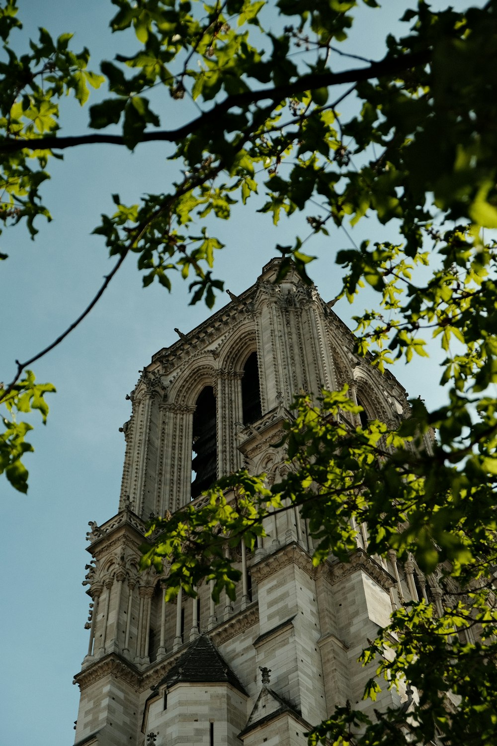 a very tall tower with a clock on it's side