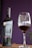 A bottle of wine labeled 'Familia Ibarra Vinos' is placed next to a filled wine glass. The background is a deep purple, adding contrast and elegance to the scene.