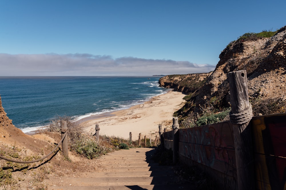 a view of a beach from a cliff