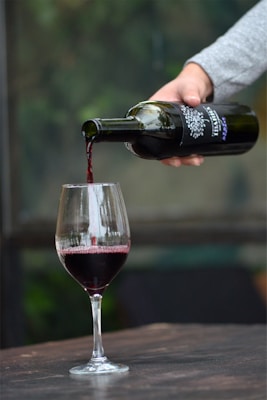Red wine being poured into a glass