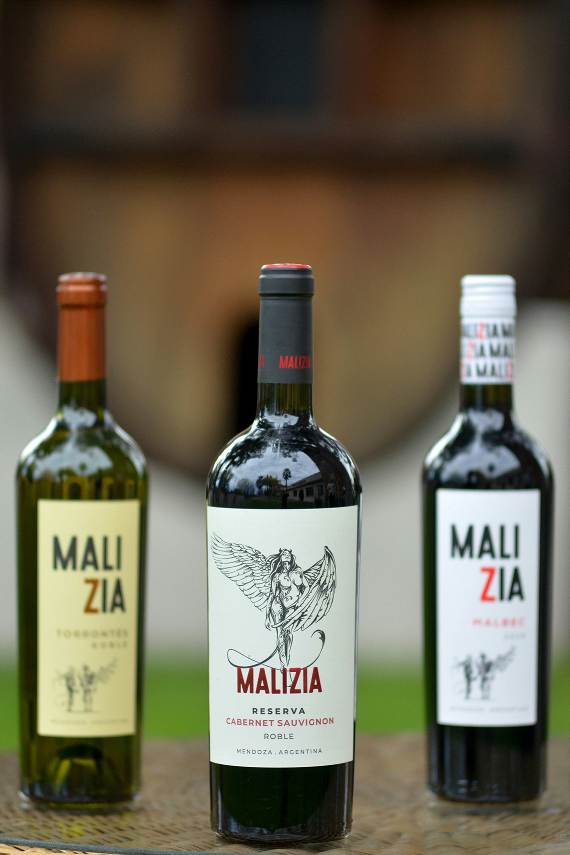 three bottles of wine sitting on top of a table