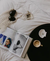 A stylish flat lay of seasonal Auravive pieces arranged with accessories on a soft luxury-toned background.
