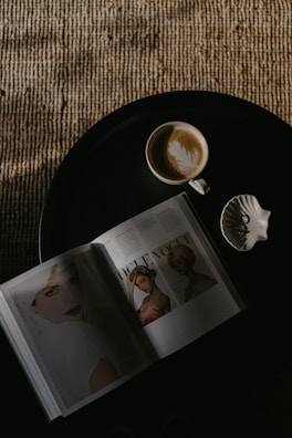 An overhead shot of a coffee table with 3D printed decor pieces in earthy tones.