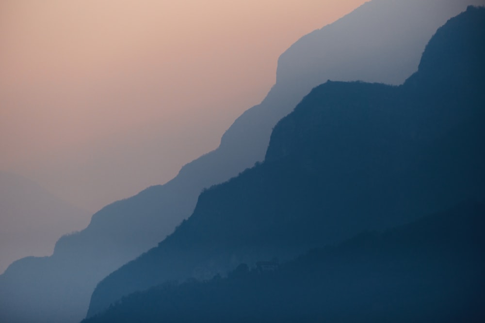 a plane is flying over a mountain range