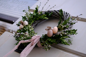 a wreath with an egg on top of it
