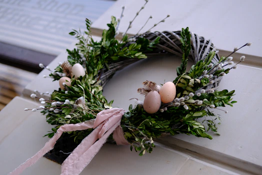 a wreath with an egg on top of it