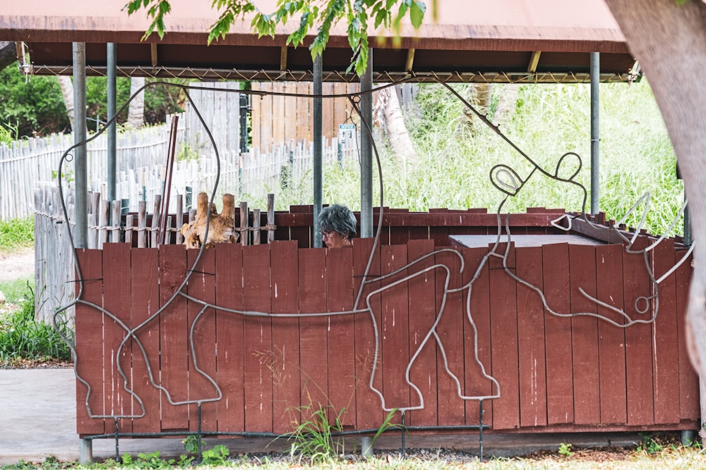 a wooden fence with a drawing on it