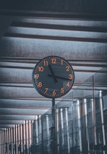 a clock on a pole in a building