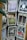 A collection of vintage-style postcards displayed on a rotating rack, featuring artistic illustrations and typography. Each postcard has a unique design and depicts different themes, such as landscapes, animals, and abstract art. The cards are displayed in metal holders attached to a wooden stand.