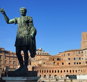 a statue of a roman soldier in front of a building