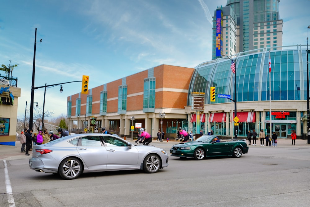 a couple of cars that are sitting in the street