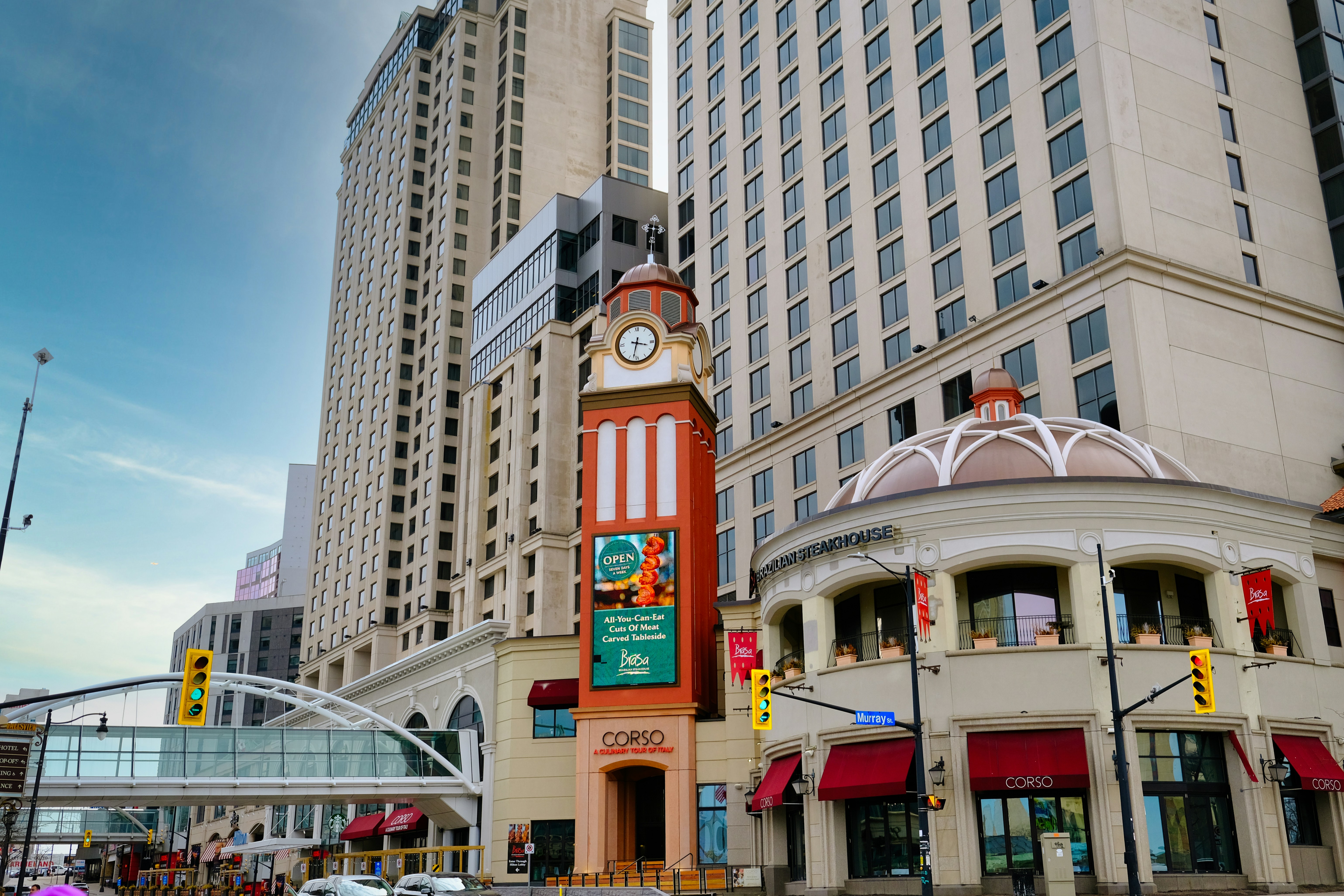 a tall clock tower sitting in the middle of a city
